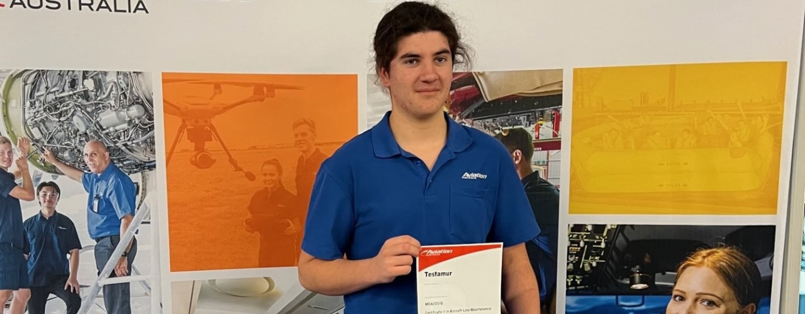 Student holding a certificate